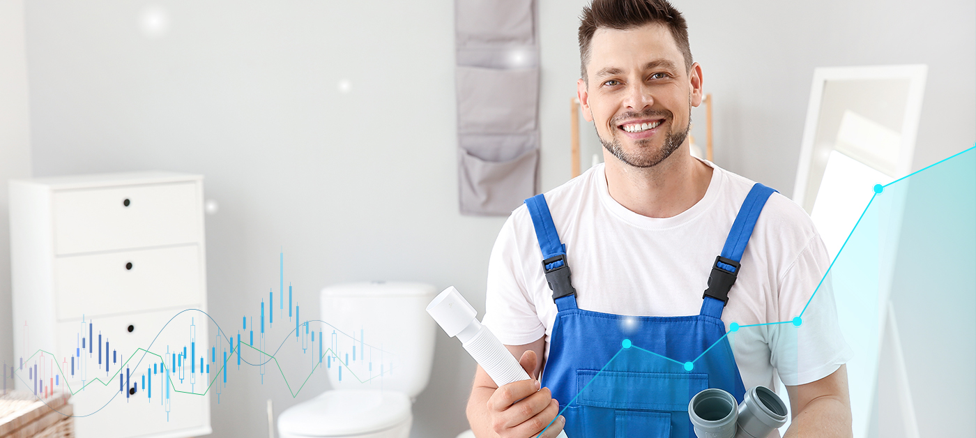 A plumber in a blue and white dress standing with pipes and fittings gives plumbing tips for the business growth